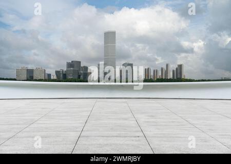 empty ground floor with modern cityscape and cloudy sky. empty copy space. Stock Photo