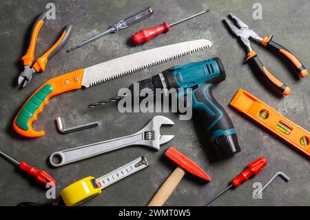Various repair tools, hardware materials, drill, hammer, pliers, screwdriver, wrench Stock Photo