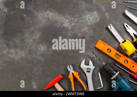 Various repair tools, hardware materials, drill, hammer, pliers, screwdriver, wrench Stock Photo