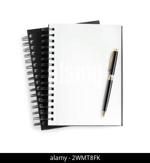 Two notebooks and pen isolated on white, top view Stock Photo
