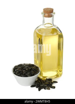 Vegetable fats. Sunflower oil in glass bottle and seeds isolated on white Stock Photo