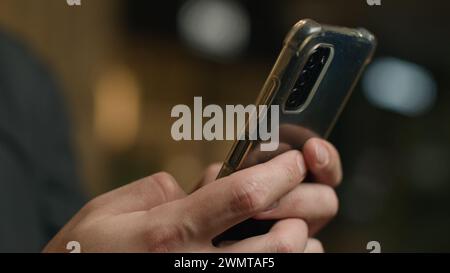 Close-up male hands chatting cellphone screen typing message touchscreen on mobile phone unrecognizable man businessman texting smartphone make online Stock Photo