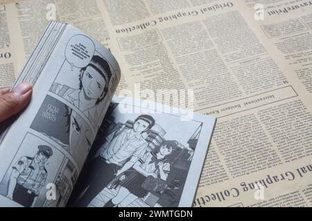 August 31, 2023, Close-up of an open comic book with bokeh background. Wadaslintang, Wonosobo Stock Photo