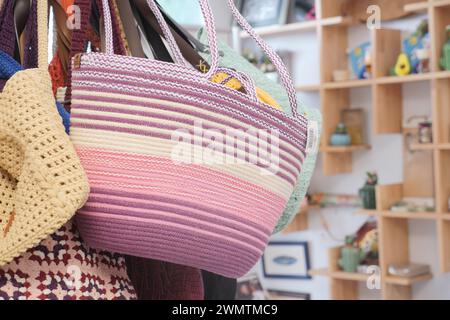 woolen pink and purple striped bag in a store Stock Photo