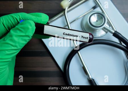 Cadmium - Test with blood sample on wooden background. Healthcare or medical concept Stock Photo