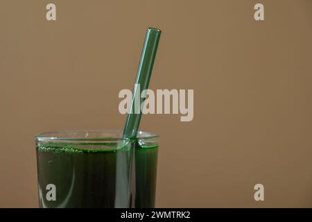 Organic blue-green algae spirulina detox drink in glass powder food. Health protein cocktail smoothie of chlorella. Vitamins and minerals to diet. Prebiotic and antioxidant rich Dietary supplement Seaweed superfood concept Stock Photo