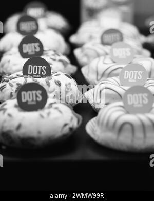 An assortment of Donuts with sprinkles on top Stock Photo