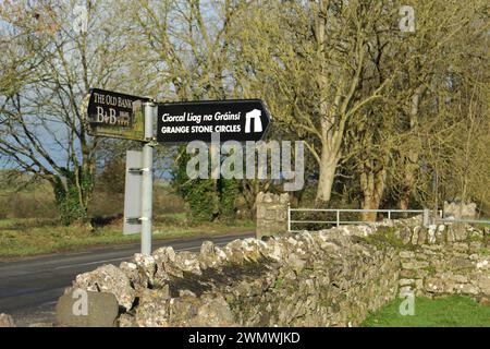 Sign written in Irish Gaelic and English for the Grange Stone Circle Lough Gur in winter. Largest Celtic stone circle in Europe in County Limerick Stock Photo