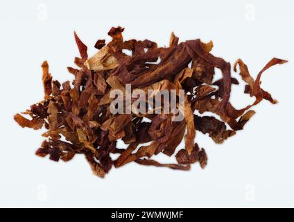 A close-up of loose-leaf tobacco isolated on a white background Stock Photo