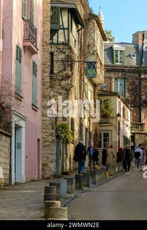 Paris, France - February 17, 2024 : View of tourists walking in the picturesque area of Montmartre in Paris France Stock Photo