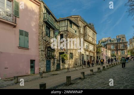Paris, France - February 17, 2024 : View of the picturesque area of Montmartre and the famous pink restaurant, La Maison Rose, in Paris France Stock Photo
