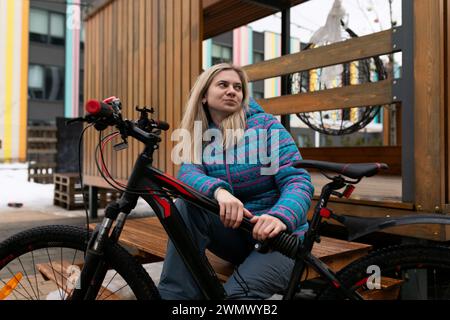Nice young woman rented a bicycle Stock Photo