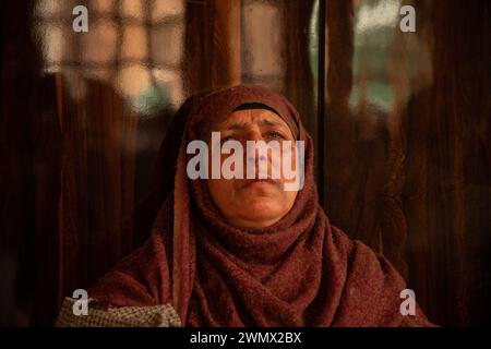Mother of Azad Yousuf Kumar, grieves at her home in Pulwama 