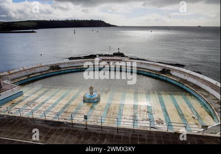 Looking sad after the winter weather Plymouth’s iconic art deco Tinside Lido on the shore of Plymouth Sound. Soon it will get it’s annual clean up to Stock Photo