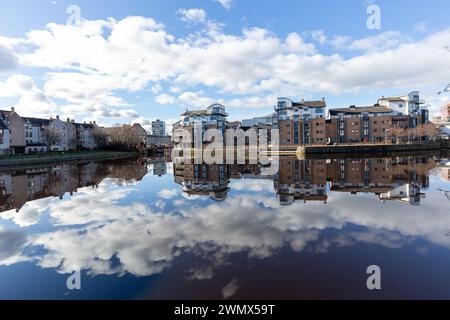 A mirror like reflection of clouds on the Water of Leith, Edinburgh, Scotland Stock Photo
