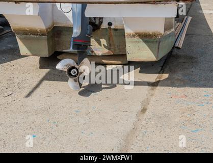 Propeller and rudder shaft of outboard engine used to power small fishing boat in Pyeongtaek, South Korea Stock Photo