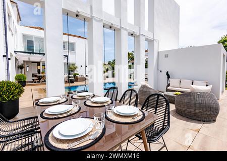 an outdoor set up dining table ready for lunch in mediterranean mansion Stock Photo