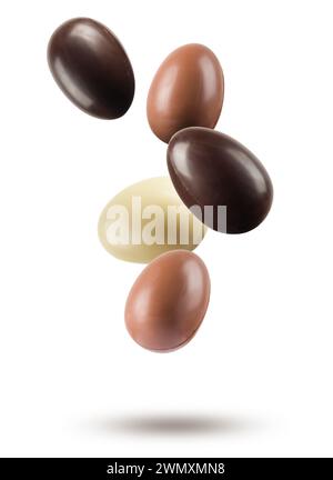 Chocolate easter eggs floating on white background. Stock Photo