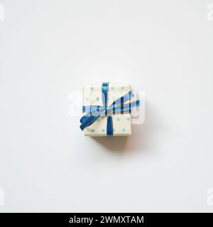Blue dot pattern ivory gift box isolated on white background. top view Stock Photo