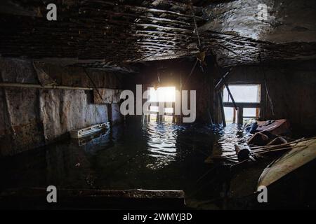 Flooded old house interior. Natural disaster concept. Stock Photo