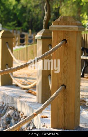 rope railing made of wood. wooden fence Stock Photo - Alamy