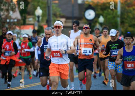 Babylon, New York, USA - 22 October 2023: Front view of runners at the start of a half marathon and 10K on Long Island. Stock Photo