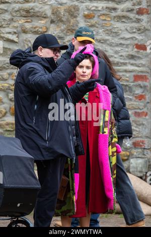 Grassington, Yorkshire, UK. 28th February 2024. Location filming begins for series 5 of the popular Channel 5 and PBS show All Creatures Great & Small. Cast and crew were spotted on the streets of the small Yorkshire Dales town of Grassington, which is converted, twice a  year, in to the fictional town of Darrowby. Pictured - Rachel Shenton (Helen Herriot) talks to director Brian Percival  Credit: Tom Holmes Photography / Alamy Live News). Stock Photo