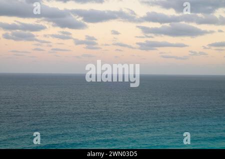 A panoramic view of dramatic sunset over caribbean sea in Cancun, Mexico Stock Photo