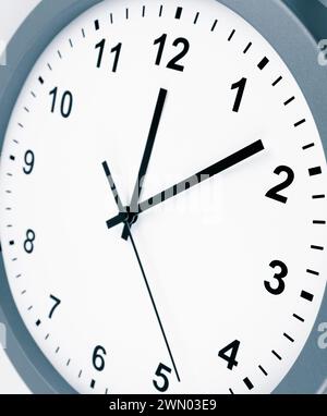 Close-up of hands on clock face Stock Photo