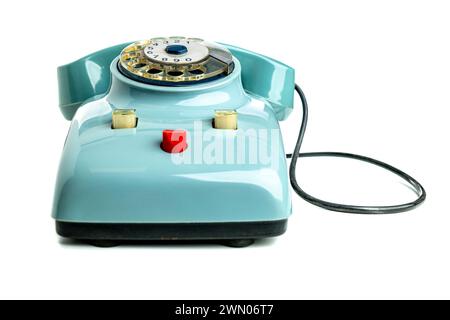 Classic blue rotary phone isolated on a white backdrop, symbolizing retro communication Stock Photo