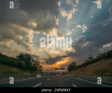 Stormy sunset on the highway near Colleferro, Rome, Italy Stock Photo