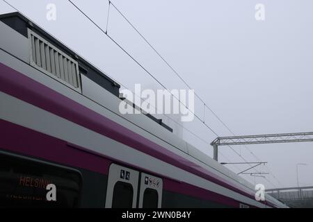 Foggy winter day in Finland. Trains and buildings in the fog Stock Photo