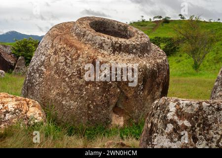 Plain of jars near Phonsavan in the central Lao highlands in Laos in South East Asia Stock Photo
