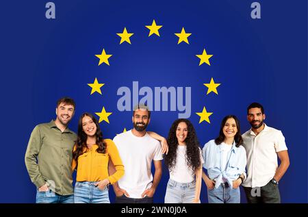 Group of five happy young adults casually dressed, posing with confidence Stock Photo