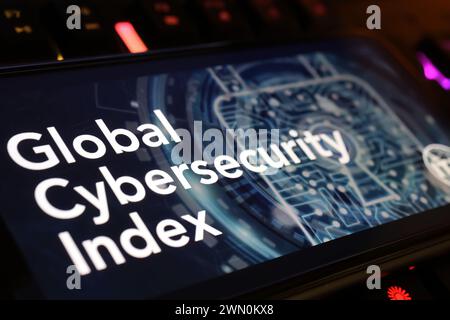 Viersen, Germany - January 9. 2024: Smartphone screen with ITU Global Cybersecurity index on computer keyboard Stock Photo