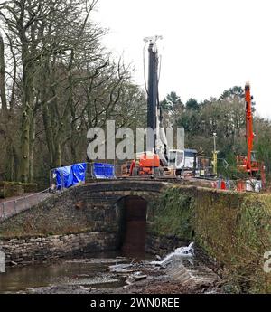 Heavy machinery on lock 7 of the Peak Forest canal as repairs to the lock are underway on the Marple flight of locks on the 27th of February 2024 Stock Photo