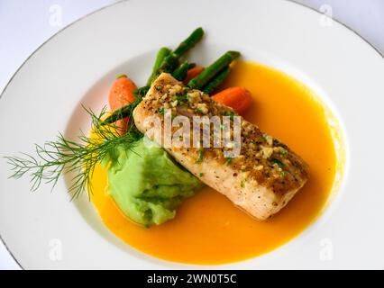Seared fish fillet with pineapple sauce at the Iguana Restaurant in Casa Kimberly, a luxury boutique hotel in Puerto Vallarta, Mexico. Stock Photo
