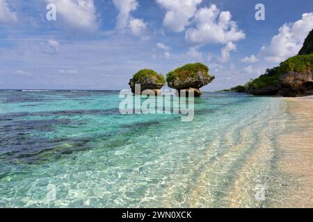 Clear warm waters and mushroom rocks at Tanguisson Beach, Guam Stock Photo