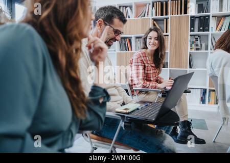 Multi generational people collaborating in a bright office setting, engaged in discussion with laptops, exuding a friendly and productive vibe. Stock Photo