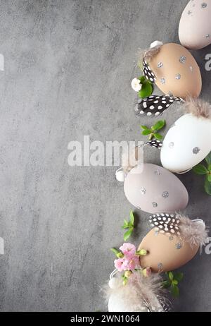 Collection of stylish colors eggs with flowers for Easter celebration on grey background. Holiday concept. Stock Photo