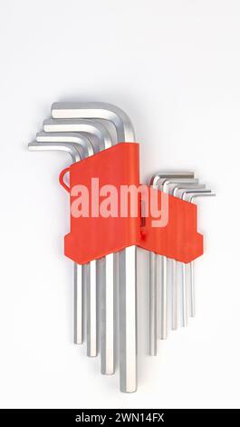 Close up of a set of hex keys in a red box. A set of hand tools for steel bolts of various sizes. Stock Photo