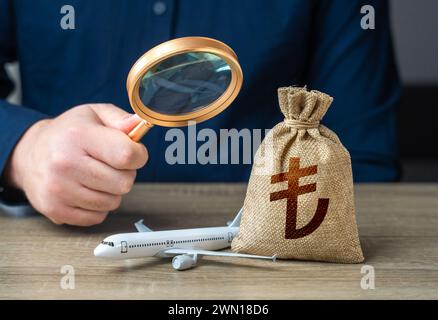 Monitoring the payment of taxes in the aviation industry and turkish lira money bag. Fostering financial integrity, regulatory adherence, and sustaina Stock Photo