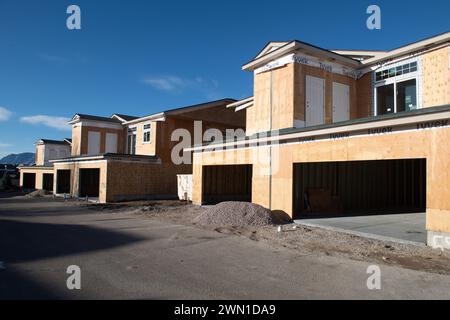 Duplexes and townhomes under construction in the Rockrimmon area of northern Colorado Springs, Colorado.  Large two car garages are featured. Stock Photo