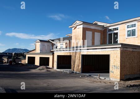 Duplexes and townhomes under construction in the Rockrimmon area of northern Colorado Springs, Colorado.  Large two car garages are featured. Stock Photo