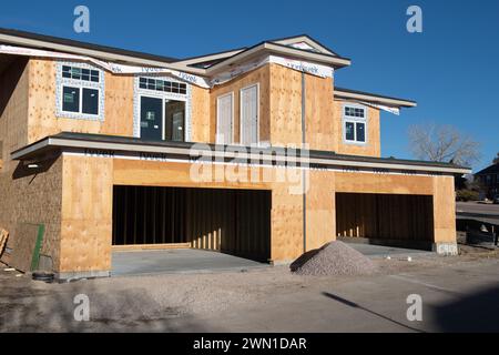 Duplexes and townhomes under construction in the Rockrimmon area of northern Colorado Springs, Colorado.  Large two car garages are featured. Stock Photo