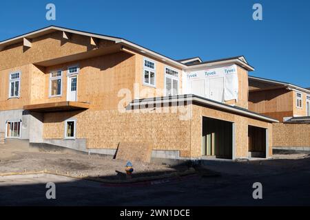 Duplexes and townhomes under construction in the Rockrimmon area of northern Colorado Springs, Colorado.  Large two car garages are featured. Stock Photo