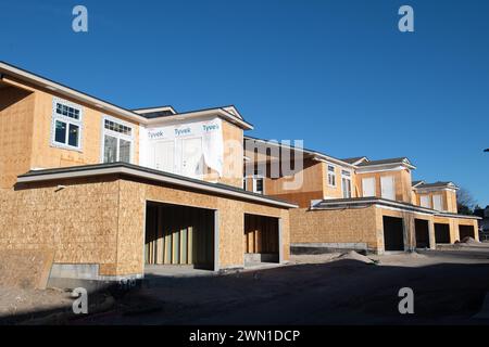 Duplexes and townhomes under construction in the Rockrimmon area of northern Colorado Springs, Colorado.  Large two car garages are featured. Stock Photo