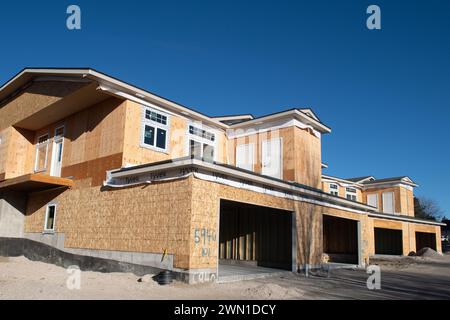 Duplexes and townhomes under construction in the Rockrimmon area of northern Colorado Springs, Colorado.  Large two car garages are featured. Stock Photo