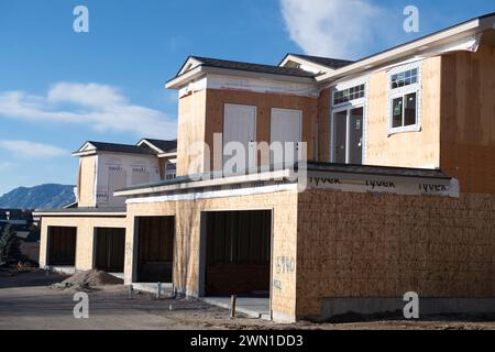 Duplexes and townhomes under construction in the Rockrimmon area of northern Colorado Springs, Colorado.  Large two car garages are featured. Stock Photo