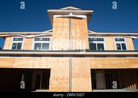 Duplexes and townhomes under construction in the Rockrimmon area of northern Colorado Springs, Colorado.  Large two car garages are featured. Stock Photo